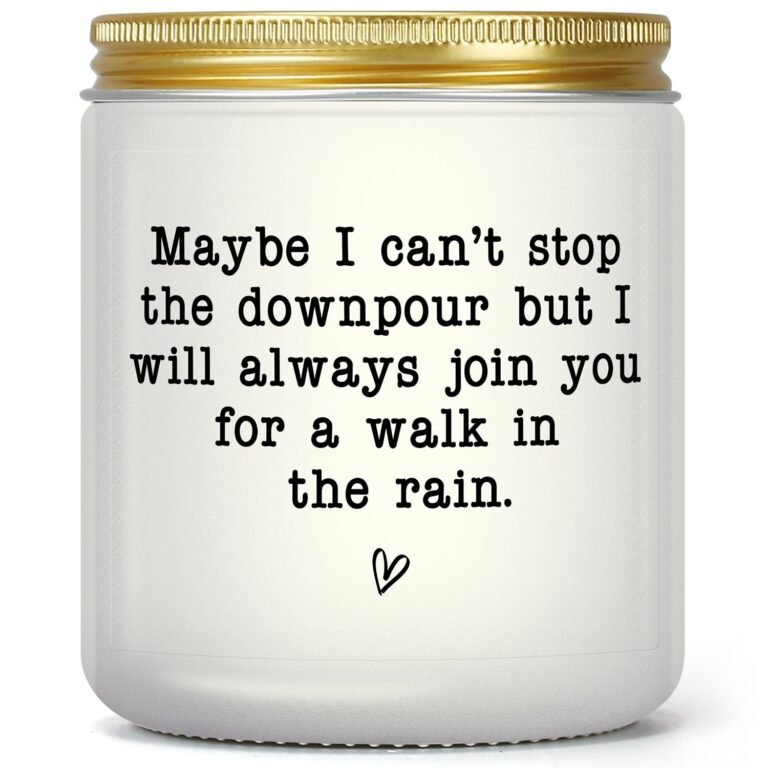 White candle with gold lid and text: "walk in the rain" with heart