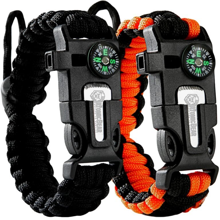 Two survival bracelets with compasses and black and orange paracord