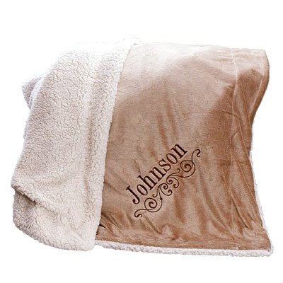 Brown and cream personalized blanket with the name "Johnson" embroidered on it