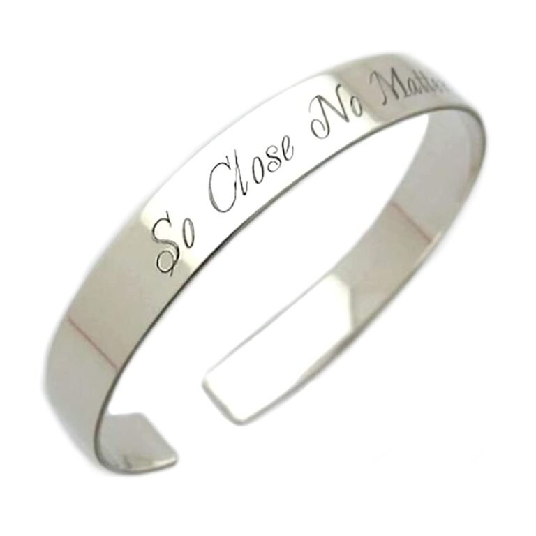 Silver cuff bracelet engraved with "So Close No Matter."