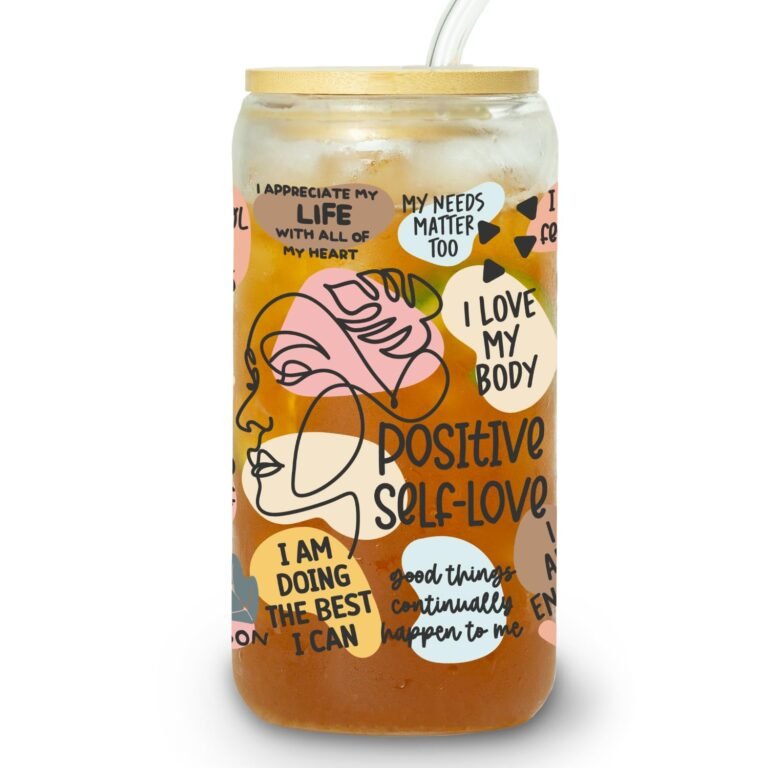 Glass tumbler with positive affirmations, ice, straw, and bamboo lid