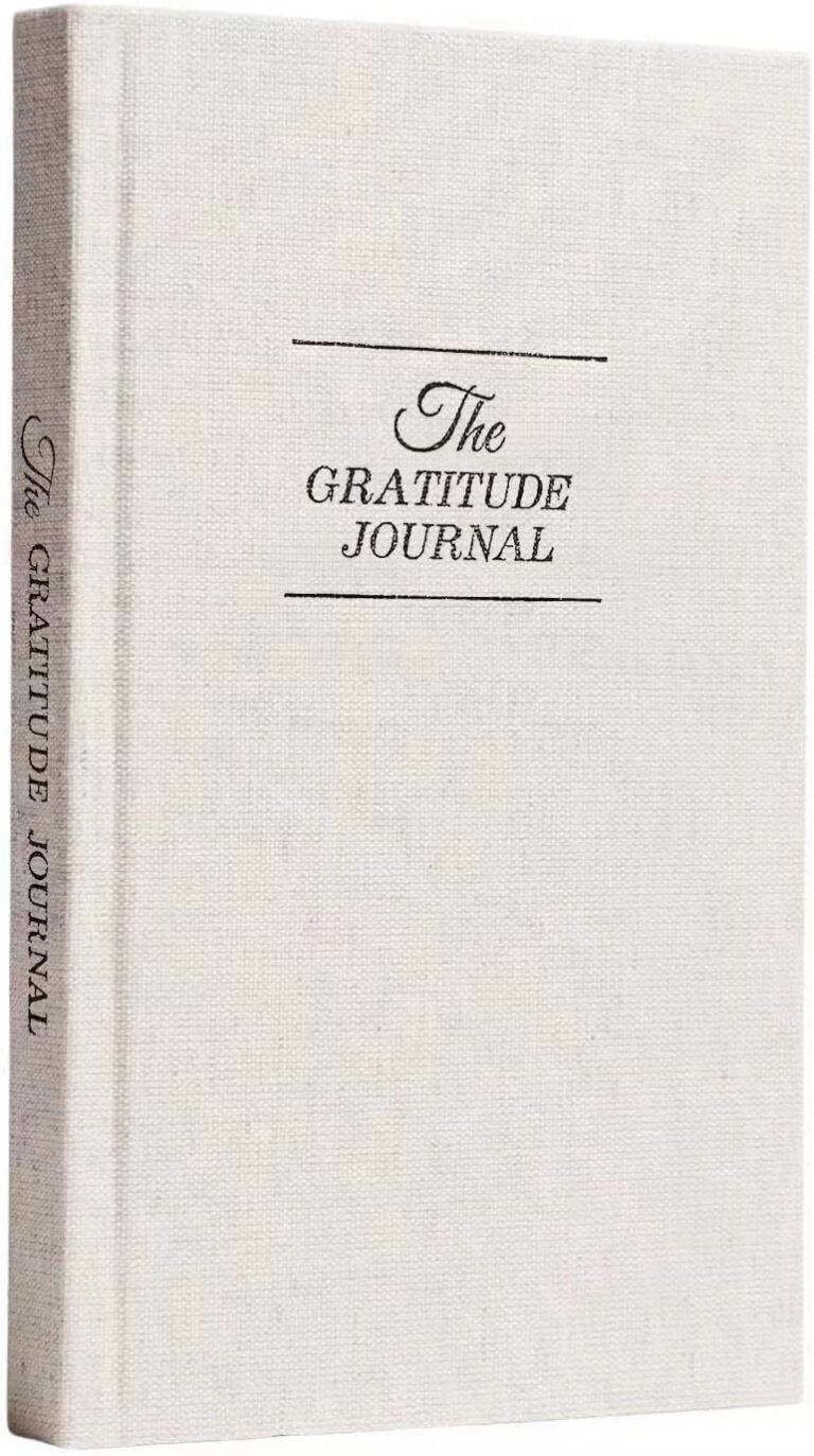 Off-white "The Gratitude Journal" book with elegant script and lines
