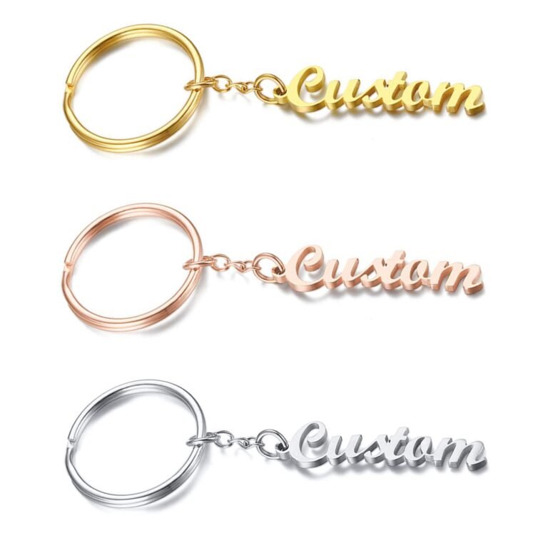 Three keychains with "Custom" script in gold, rose gold, and silver