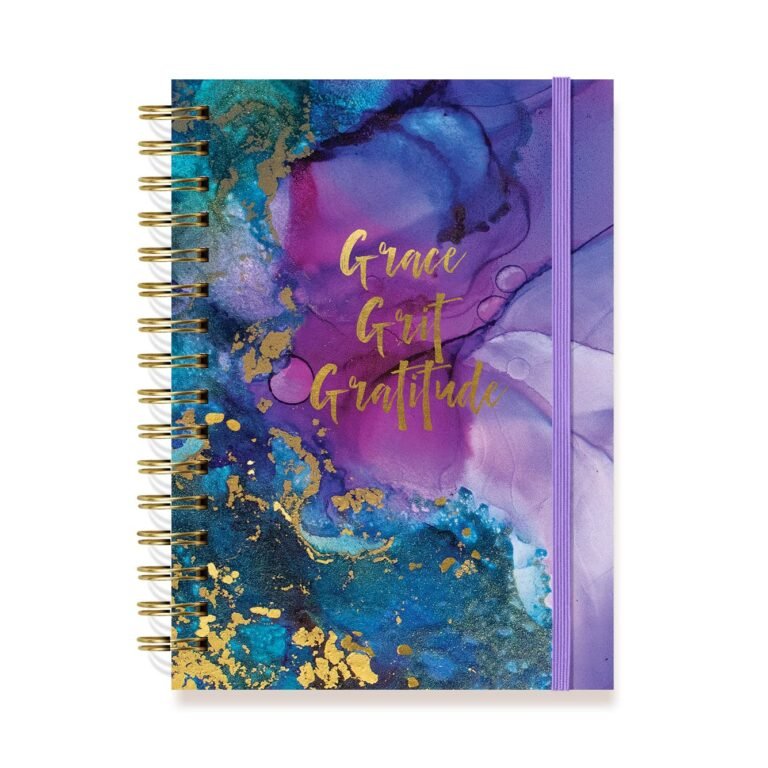 Spiral-bound notebook with "Grace, Grit, Gratitude" on a colorful abstract design