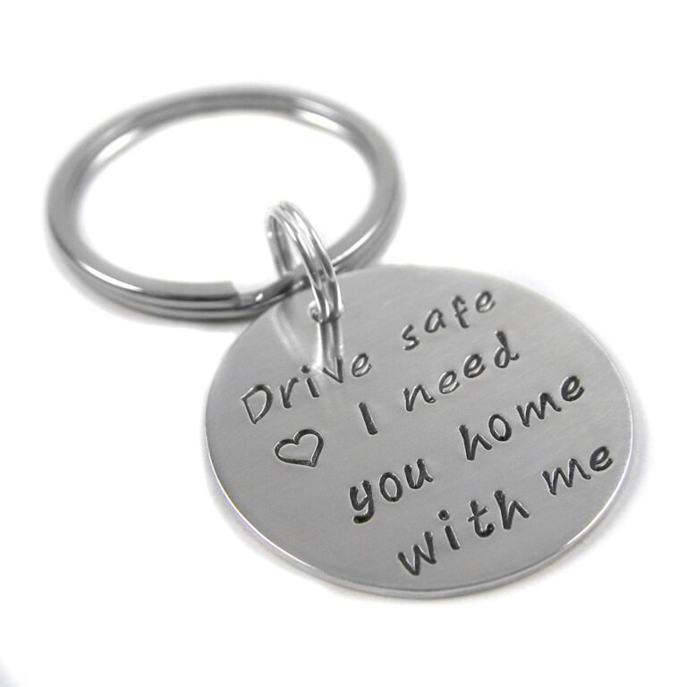 Silver keychain with "Drive safe, I need you home with me" engraved