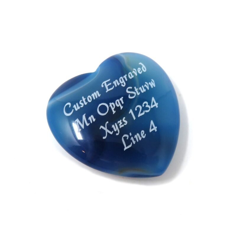 Blue heart-shaped stone with custom engraved text in white