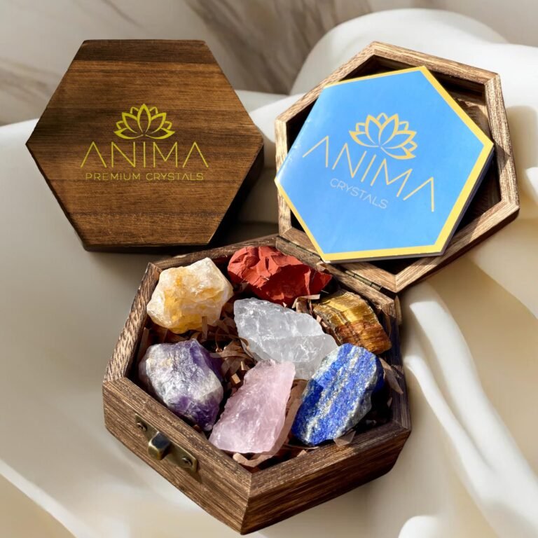 Wooden boxes with crystals, one open with a blue card, and crystals inside