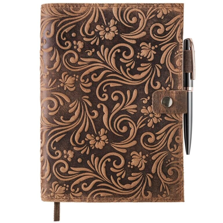 Brown leather journal with floral embossed design and pen